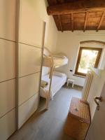 a bedroom with a bunk bed and a window at Villa Broglia House in Verona