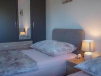 Posteľ alebo postele v izbe v ubytovaní Apartmani Goga 2