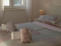 Posteľ alebo postele v izbe v ubytovaní Apartmani Goga 2