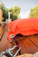 an orange bag on top of a wooden table at 4u Bed &amp; Spa in Opoul-Périllos