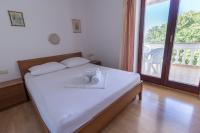 Postel nebo postele na pokoji v ubytování Apartment Dony - Tičić