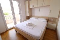 Postel nebo postele na pokoji v ubytování Apartment Dony - Tičić