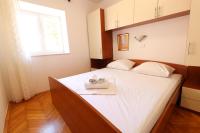 Postel nebo postele na pokoji v ubytování Apartment Dony - Tičić
