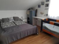 Posteľ alebo postele v izbe v ubytovaní Apartman Atelier