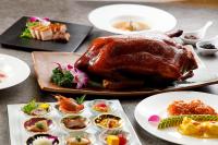 a table topped with a roast turkey and plates of food at Karuizawa Prince Hotel West in Karuizawa