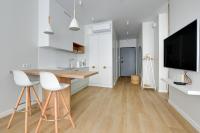 Televízia a/alebo spoločenská miestnosť v ubytovaní Comfort Apartments Granaria
