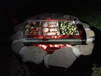 a tray of food on top of a fire pit at GITE IBARLA BORDA in Bidarray