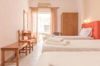 Posteľ alebo postele v izbe v ubytovaní Nikos Rooms