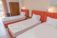 Posteľ alebo postele v izbe v ubytovaní Nikos Rooms