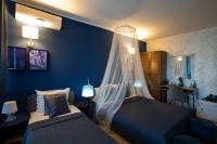 Postel nebo postele na pokoji v ubytování Sunrise Hotel