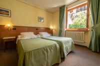 Posteľ alebo postele v izbe v ubytovaní Hotel Beau Sejour Pré-Saint-Didier