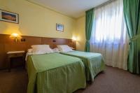 Posteľ alebo postele v izbe v ubytovaní Hotel Beau Sejour Pré-Saint-Didier