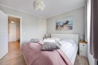 Posteľ alebo postele v izbe v ubytovaní Apartamenty Sun & Snow Rezydencja Park