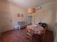 A seating area at APPARTAMENTO CASA MARCO
