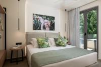 Postel nebo postele na pokoji v ubytování Mossa Well Being Hotel
