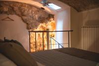 A bed or beds in a room at Aurora Medieval House