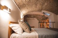 A bed or beds in a room at Aurora Medieval House