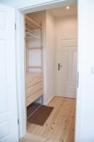 a room with a closet with a wooden floor at Gut Boltenhof in Fürstenberg