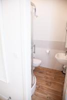 a bathroom with a toilet and a sink at Gut Boltenhof in Fürstenberg