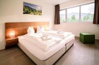Łóżko lub łóżka w pokoju w obiekcie Tauernresidence Radstadt by ALPS RESORTS