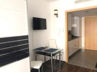 A television and/or entertainment centre at Relax and Spa - DeLux Apartman