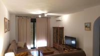 A television and/or entertainment centre at Apartamento Jardines