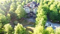 an aerial view of a house with a car parked in front at Rothenburg Lodge in Wujie