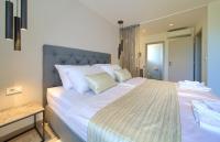 Łóżko lub łóżka w pokoju w obiekcie Apartments Vista Deluxe