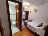 A bed or beds in a room at Hostal Giadás