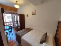 A bed or beds in a room at Hostal Giadás