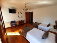 A bed or beds in a room at Hostal Giadás
