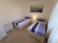 Posteľ alebo postele v izbe v ubytovaní Apartment in Crikvenica 34973