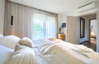 Łóżko lub łóżka w pokoju w obiekcie Apartments Vista Deluxe