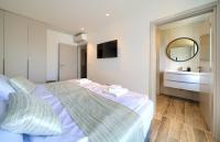 Łóżko lub łóżka w pokoju w obiekcie Apartments Vista Deluxe