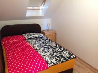 Posteľ alebo postele v izbe v ubytovaní King Apartman