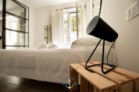 A bed or beds in a room at Ostia Holiday Lotito Loft