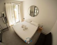A bed or beds in a room at Ostia Holiday Lotito Loft