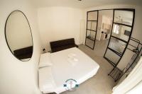 A bed or beds in a room at Ostia Holiday Lotito Loft