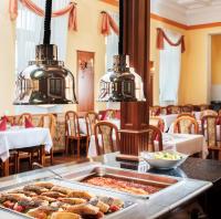 a buffet with food on a table in a restaurant at Reitenberger Spa Medical in Mariánské Lázně