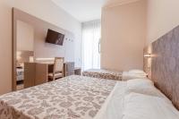 A bed or beds in a room at Hotel San Giorgio