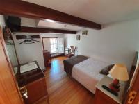 A bed or beds in a room at Hostal Giadás