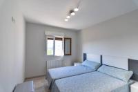 Postel nebo postele na pokoji v ubytování ¡Nuevo! Casa reformada, cómoda y con vistas al mar