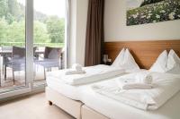 Łóżko lub łóżka w pokoju w obiekcie Tauernresidence Radstadt by ALPS RESORTS