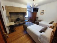 A bed or beds in a room at Hostal Giadás