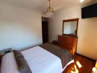 A bed or beds in a room at Hostal Giadás