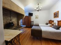 A bed or beds in a room at Hostal Giadás