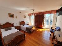 A bed or beds in a room at Hostal Giadás