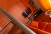 A television and/or entertainment centre at Relax al Porto - 180 degrees of exciting Garda lake views
