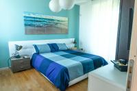A bed or beds in a room at Relax al Porto - 180 degrees of exciting Garda lake views