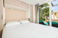 Posteľ alebo postele v izbe v ubytovaní Camping Stella Maris Mobile Homes
